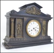 A 19th century Victorian French slate and marble architectural cased mantle clock.
