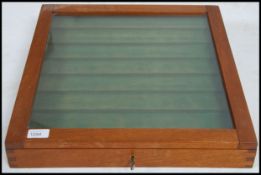 An 20th century mahogany jewellery display case with hinged glass top with clasp having a