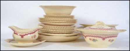 An early 20th century part dinner service by New Hall Hanley to include tureens,