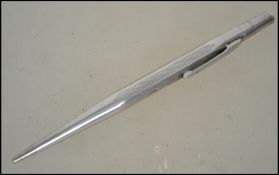 An early 20th century sterling silver propelling pencil having engine turned design.