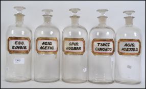 A collection of five vintage late 19th century W N Chemist Apothecary bottles .