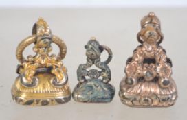 A collection of 4 Victorian intaglio seals of pinchbeck gold - yellow metal. Each with stone bases.