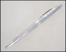 A silver hallmarked pen with monogram mark. Bearing marks for S J Rose & Son, Birmingham. Weight 20.