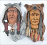 An impressive pair of hand carved and crafted wooden wall plaques of native American Red Indians,