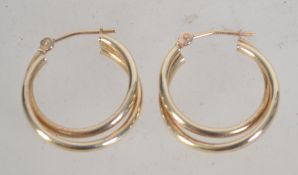 A pair of 9ct gold twing hoop earrings. Weight 1.4g.