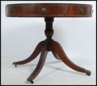 A Regency style mahogany and leather library writing centre table desk.
