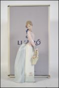 Lladro figure of lady holding basket 