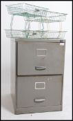 A vintage industrial mid 20th century two drawer metal filing cabinet by Triumph together with a