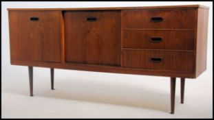 A vintage / retro mid 20th century teak sideboard having a run of three drawers to the right