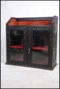 A 19th century anglo-colonial carved library bijouterie stand bookcase cabinet.