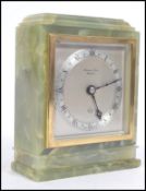 An early 20th century green marble mantel clock by Elliott.