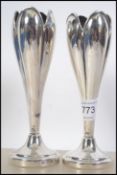 A pair of silver hallmarked bud vases having London assay marks, dating to 1934.