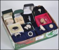 A collection of eleven costume jewellery and silver dress rings to include mother of pearl,