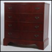 A Georgian revival serpentine fronted / bow fronted mahogany bachelors chest raised on bracket feet