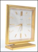 A 1930's Art Deco well made Looping of Switzerland heavy brass quality mantel clock with baton