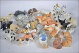 A large collection of miniature ceramic cats from the Danbury Mint ' New Cats of Character ' series
