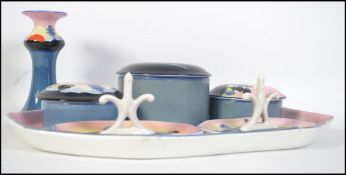 A stunning 20th century Art Deco hand painted Bristol Poutney dressing table set.