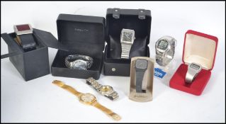 A collection of watches to include a cased Accurist silver dial gents wristwatch with day/date