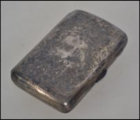 A silver hallmarked cheroot case having chased scroll work decoration.