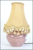 A 1930's lustre ceramic table lamp of bulbous form marked to the base CH France.