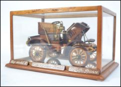 An impressive hand carved and crafted cased wooden model of the French 1903 De-Dion Bouton Model R