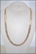 A hallmarked 9ct gold diamond cut curb link chain necklace. Hallmarked for London.