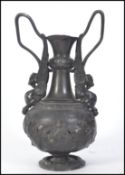 An unusual pewter 19th century polished pewter - metal continental twin handled griffin vase with