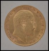 Coins. An Edward VII gold half Sovereign, 1910, St George and the Dragon to verso.