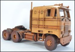 An impressive hand carved and crafted wooden American Lorry being fully articulated with hinged cab