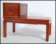 A good 20th century Chinese hardwood hallway telephone table of rectangular form having squared