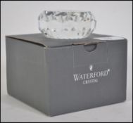 A boxed Waterford Crystal paperweight commemorating the Sydney 2000 Olympic games.