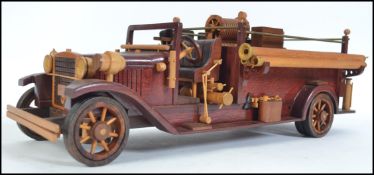 An impressive hand carved and crafted cased wooden model of a San Diego fire truck having moving