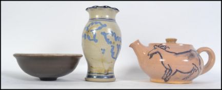 A group of three 20th century studio pottery pieces to include a teapot with a Picasso style goat