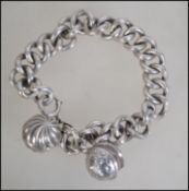 A stunning late 19th century early 20th century silver ribbed belcher link bracelet having fruit