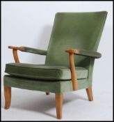 A 20th century vintage Parker Knoll open framed armchair having a spring base with original fabric