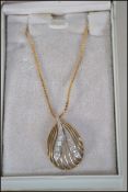 A hallmarked 9ct gold and diamond pendant necklace with ball clasp. Weight 5.6g.