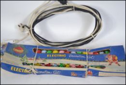 A set of vintage 1960's Christmas lights still in the original packaging.