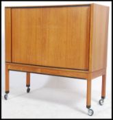 A 1970's Danish retro tambour fronted side cabinet - hall cabinet raised on squared legs with