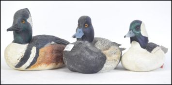A trio of beautiful hand carved wooden painted ducks / decoy's.