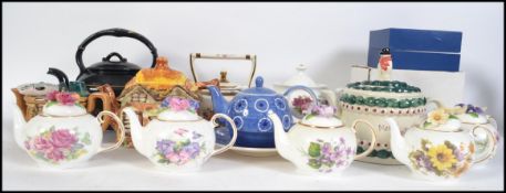 A collection of various China and ceramic teapots from various makers to include Arthur Wood etc.