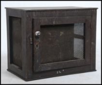 An early 20th century vintage wooden and mesh meat safe.