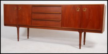 A 1970's McIntosh teak wood sideboard dresser of low and long proportions.