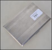 A silver hallmarked cigarette case with engine turned case being marked for Dudley Russell Howitt