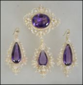A Georgian seed pearl and amethyst suite consisting of a pair of drop earrings together with