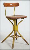 A vintage / retro mid 20th century industrial machinist's metal tubular swivel chair.