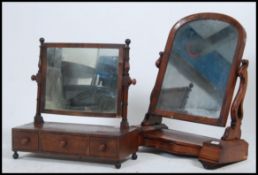 A Victorian mahogany toilet swing mirror with shaped base and large mirror together with an early