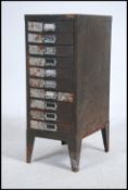 A vintage industrial mid 20th century industrial ten drawer metal filing cabinets,