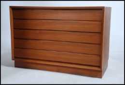 A superb Danish 1970's teak wood chest of drawers raised on an inset plinth base with beautiful