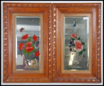 A pair of 1920's gypsy mirrors having bevelled edges with painted floral sprays and acid etchings.