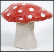 A 1970's hand made stage prop mushroom toadstool being constructed from papier mache etc.